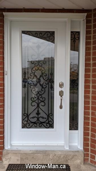 Front door with window.  Port Stanly wrought iron glass inserts
